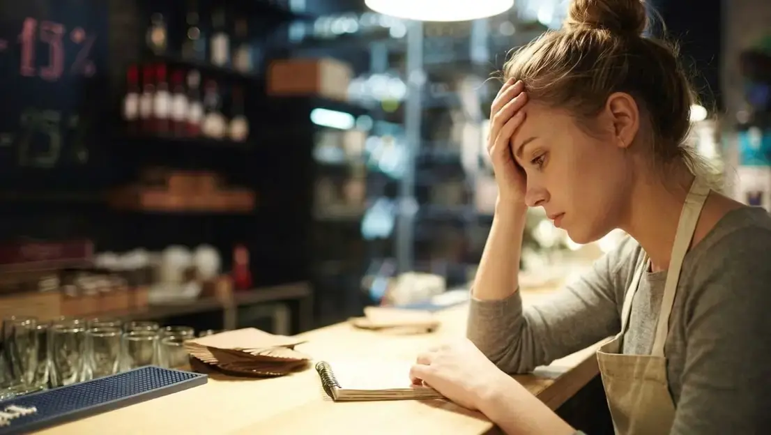 an overwhelmed restaurant worker